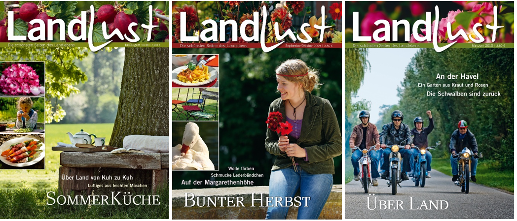 Drei Titelbilder des Magazins LandLust: Sommerausgabe mit Picknickszene, Herbstausgabe mit einer Frau, die Blumen hält, und Maiausgabe mit einer Gruppe von Menschen auf Fahrrädern.