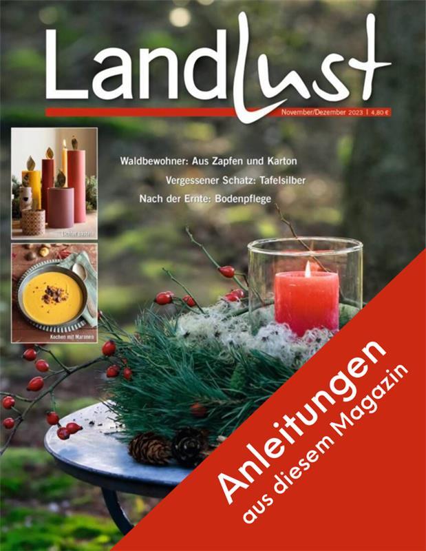 Zeitschriftentitel "Landlust" mit umverpacktem Thema: Waldbewohner, Tafelsilber, Bodenpflege. Abgebildet sind Kerzen, Tannenzweige mit Beeren. Rotes Banner mit Text Anleitungen aus diesem Magazin. Bild verlinkt zur Anleitung.