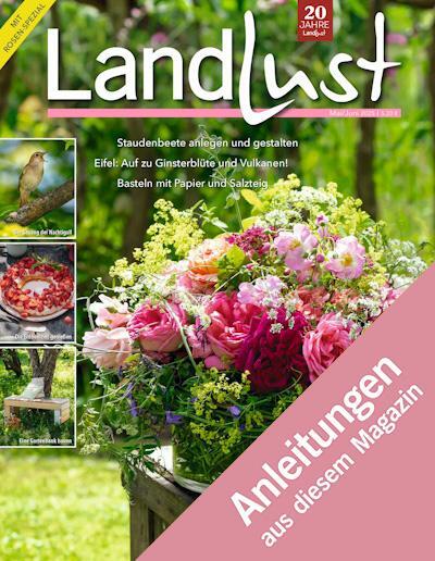 Zeitschriftencover "Landlust" mit Bild eines großen Blumenstraußes in einem Korb. Text: "Staudenbeete anlegen", "Elbe!", "Basteln mit Papier". Oben rechts: "20 Jahre Landlust". Bild verlinkt zur Anleitung.